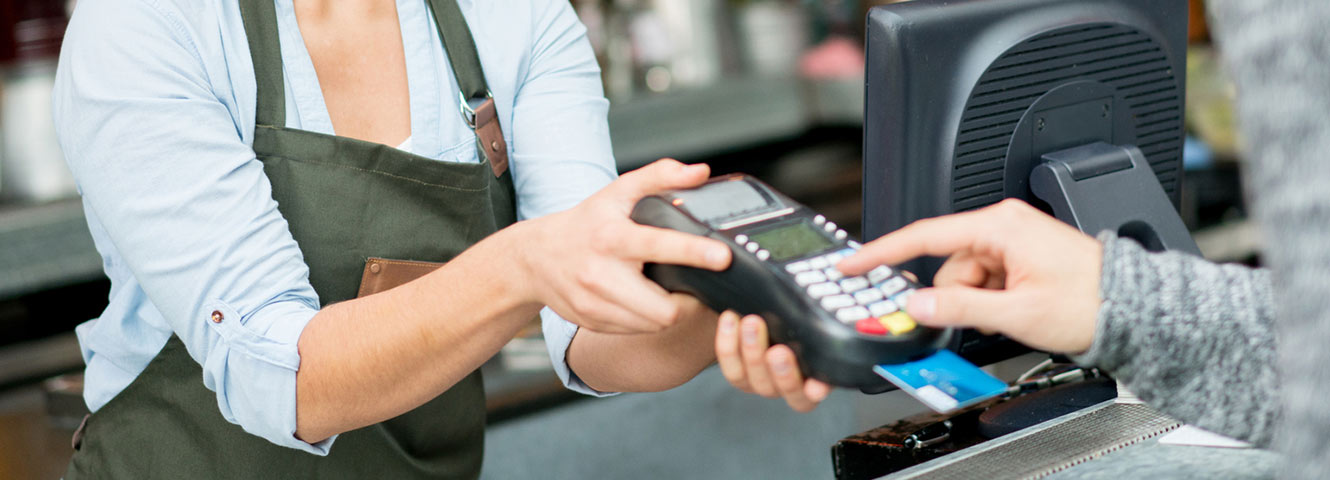 Paying with card chip reader.